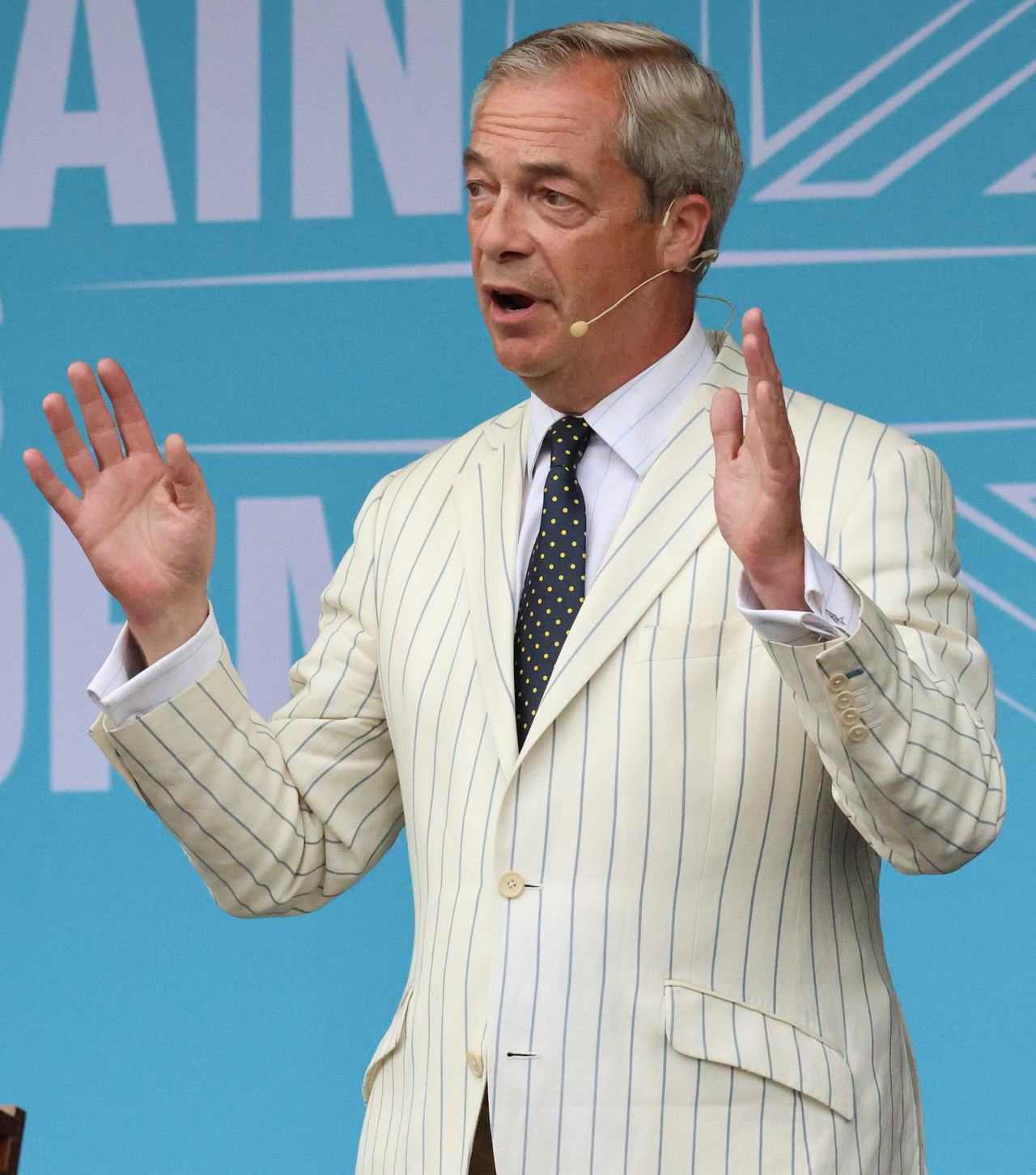 Nigel Farage addressing a Reform UK rally