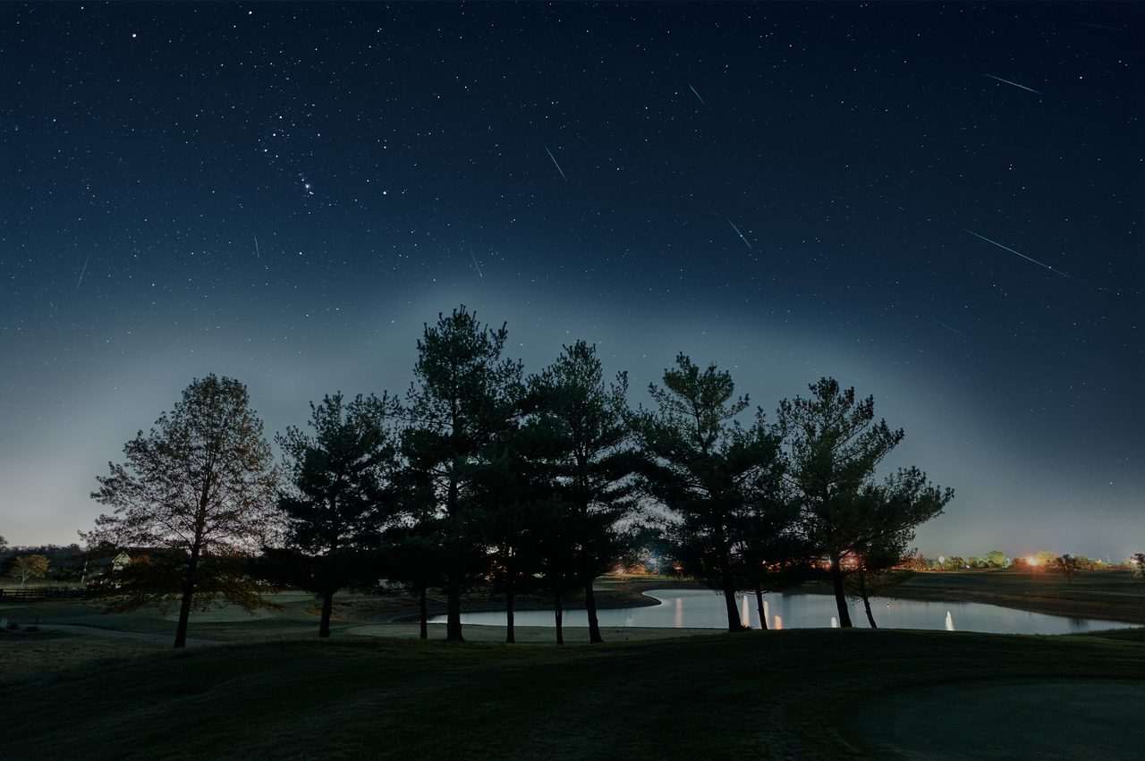 Composite image of Orionid meteors streaking across the night sky