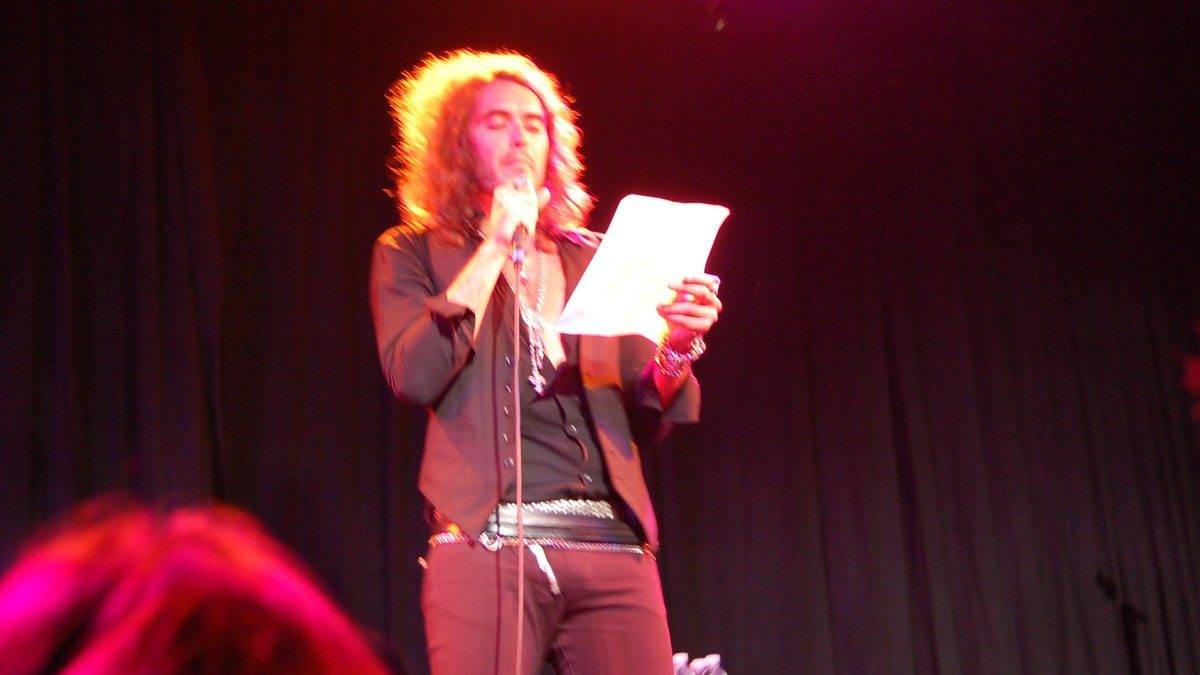 Russell Brand performing on stage in 2008