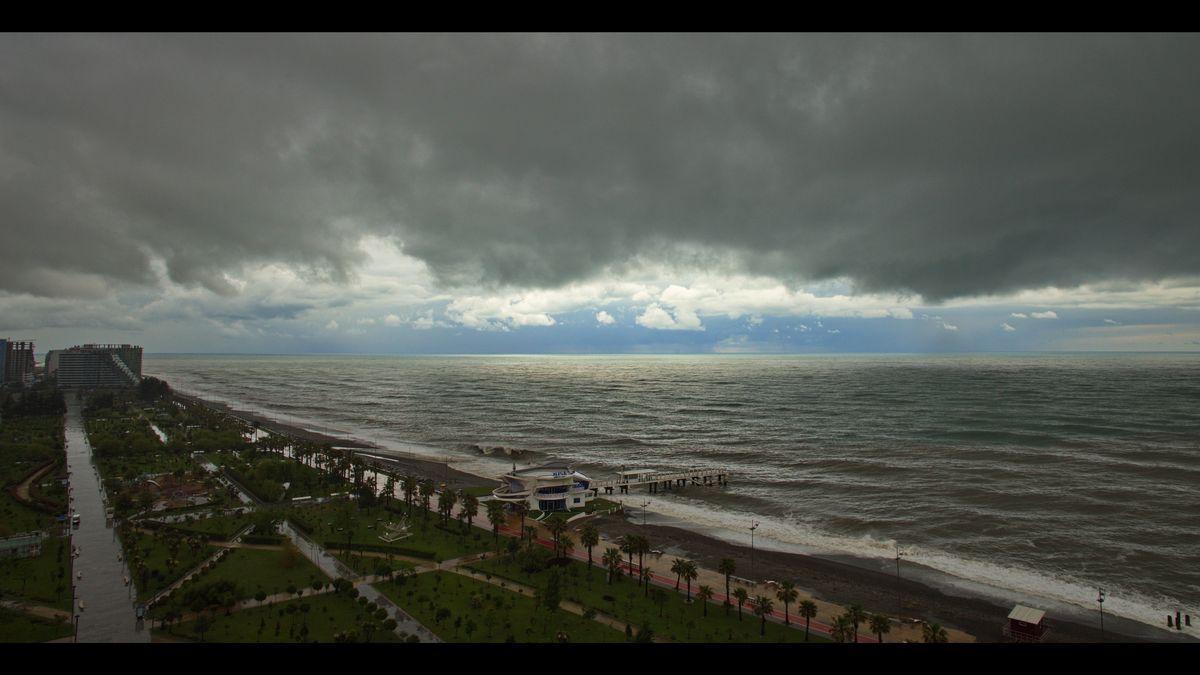 Dark storm clouds gathering over a rough sea