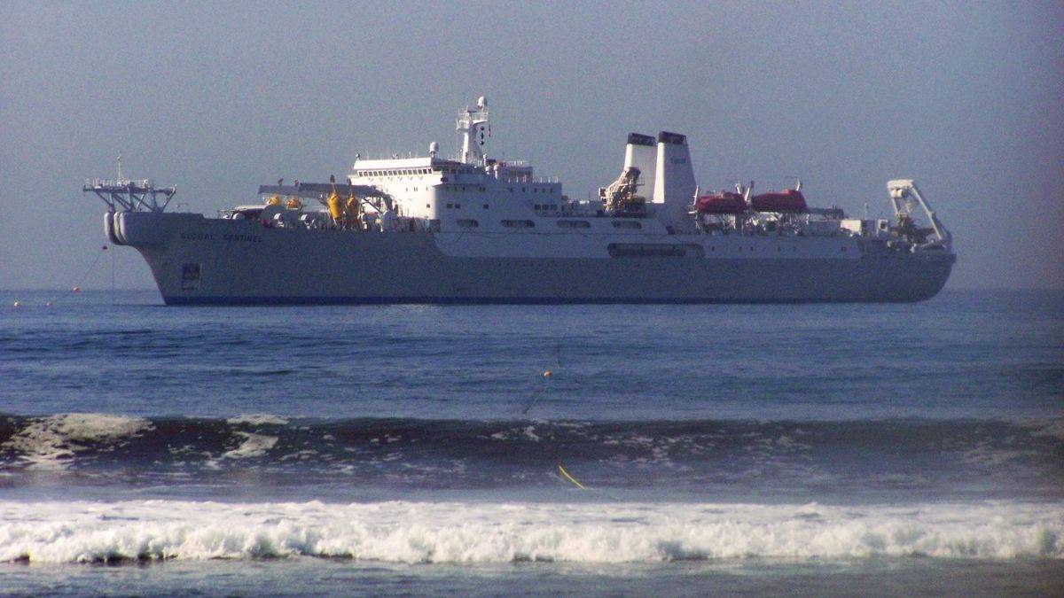 A cable-laying ship at sea installing undersea cables